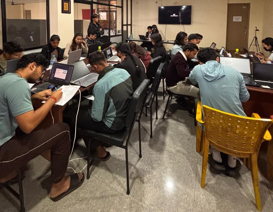 Students collaborating in tech classroom